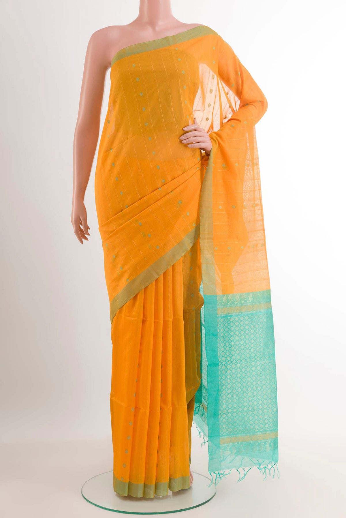 Yellow Blended Kora Cotton Saree with Zari Butta on the body and Zari Border.  displayed on a mannequin