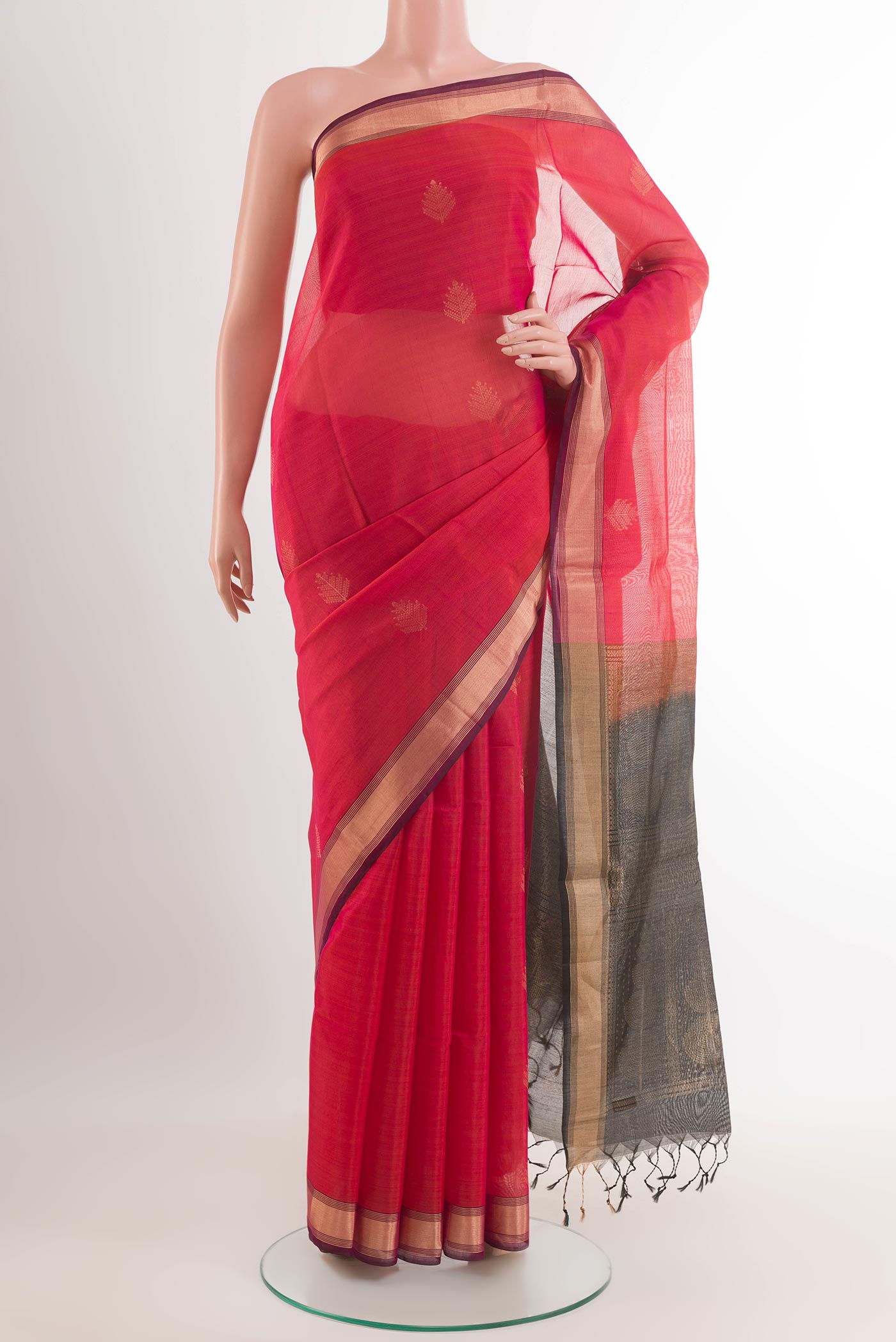 Red Blended Kora Cotton Saree with Zari Butta on the body and Zari Border.  displayed on a mannequin