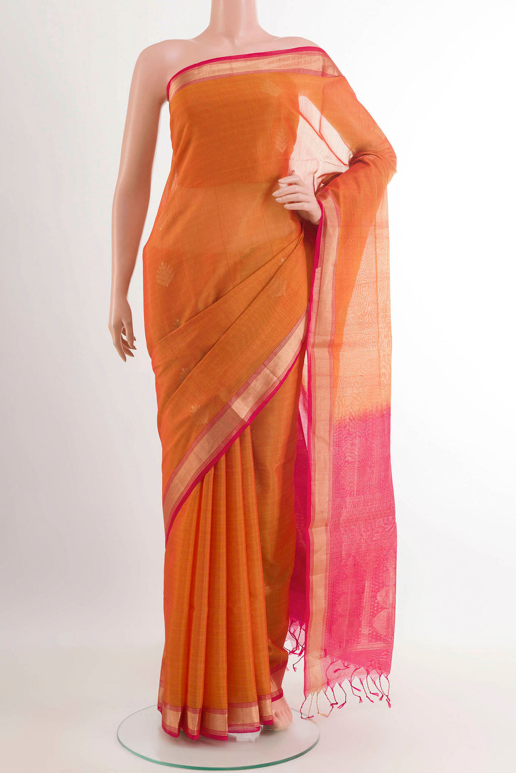 Orange Blended Kora Cotton Saree with Zari Butta on the body and Zari Border.  displayed on a mannequin