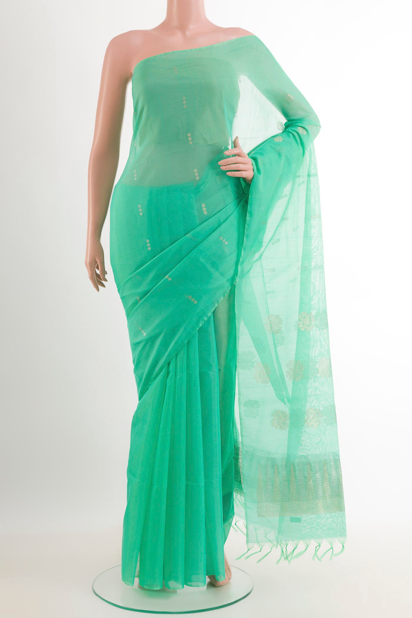 Sea Green Blended Kota Cotton Saree with Zari Butta on the body and Zari Border.  displayed on a mannequin