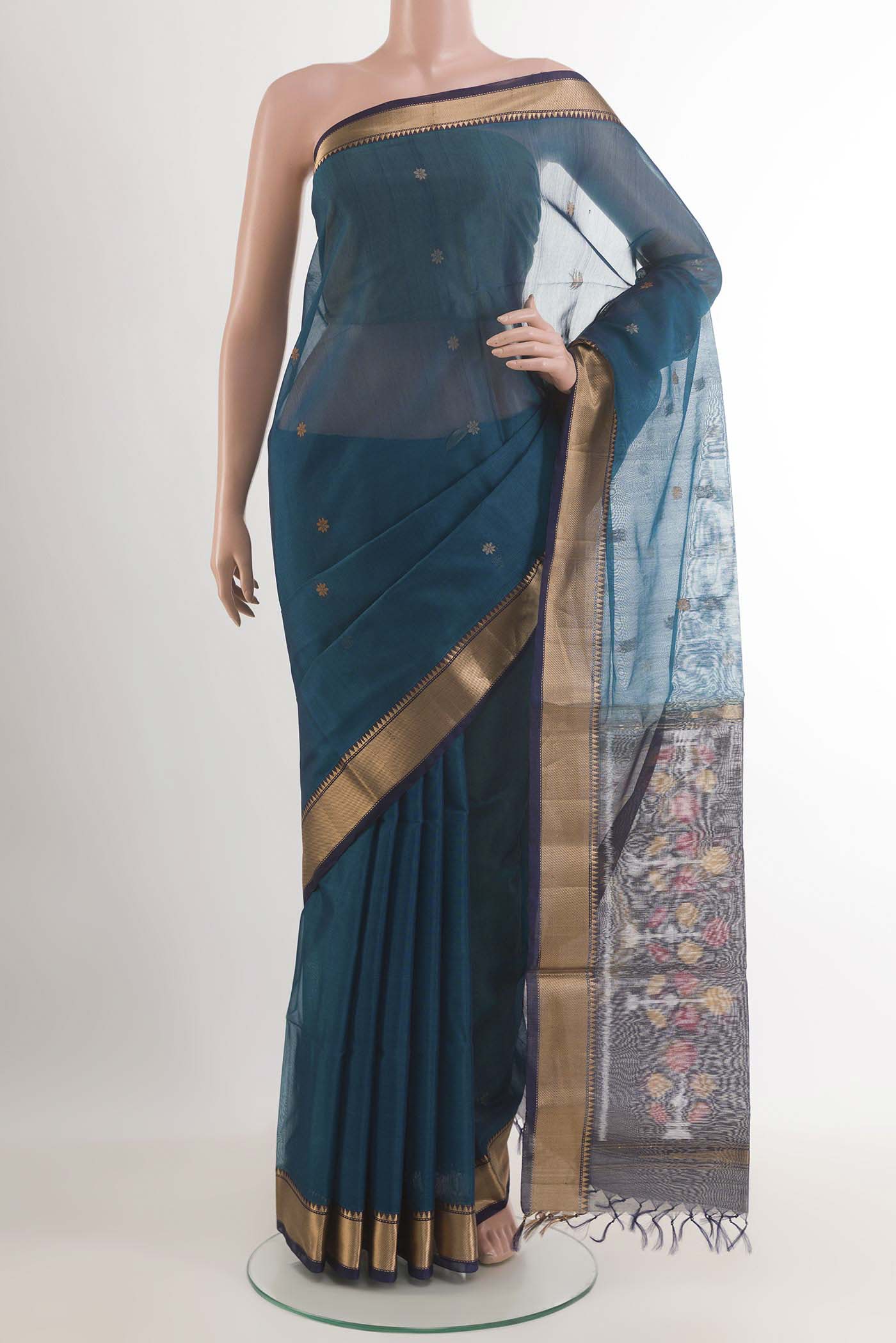 Blue Blended Chanderi Kora Silk Saree with Zari And Thread Butta on the body and Zari Border.  displayed on a mannequin