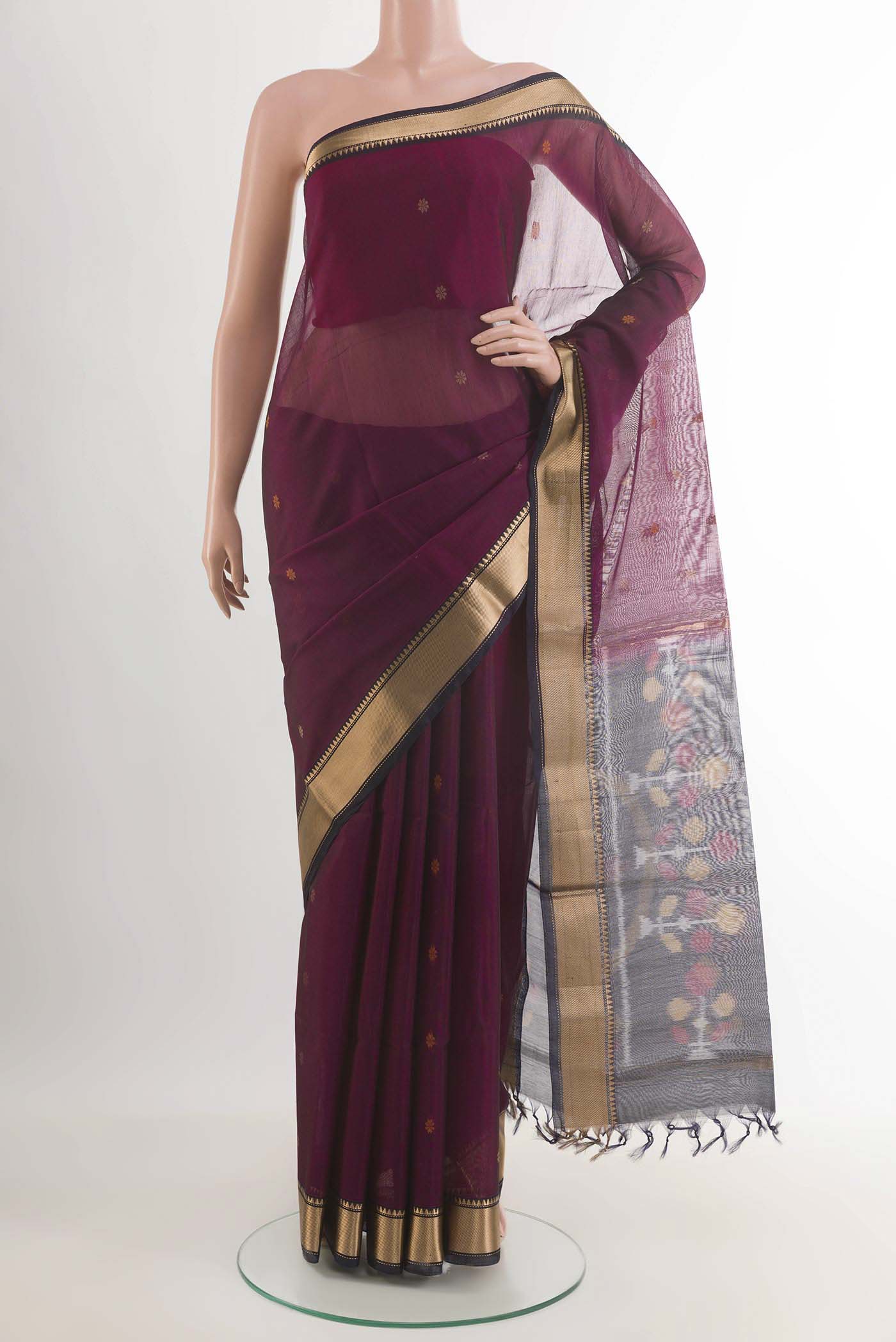 Purple Blended Kora Cotton Saree with Zari Butta on the body and Zari Border.  displayed on a mannequin