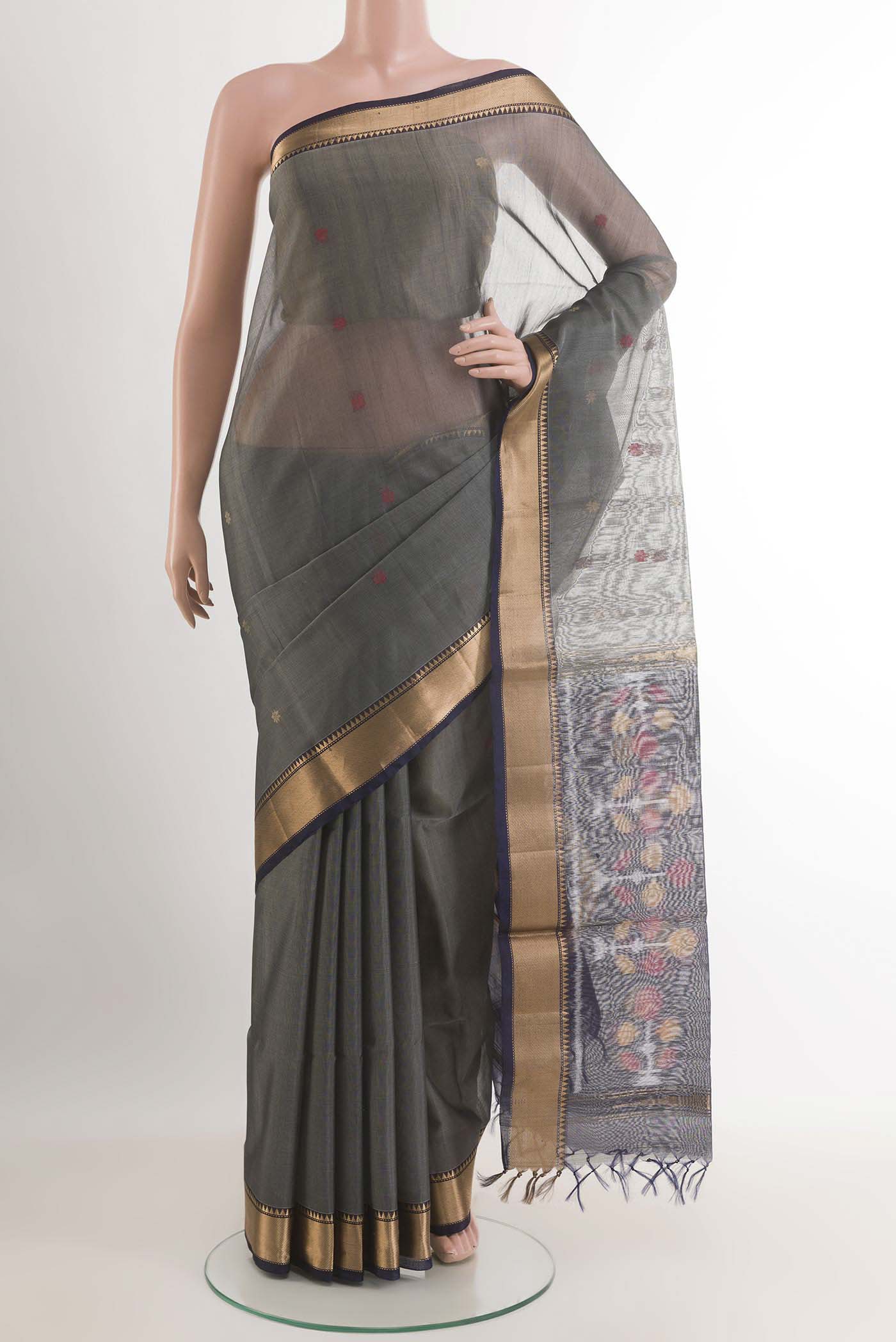 Grey Blended Chanderi Kora Silk Saree with Zari And Thread Butta on the body and Zari Border.  displayed on a mannequin