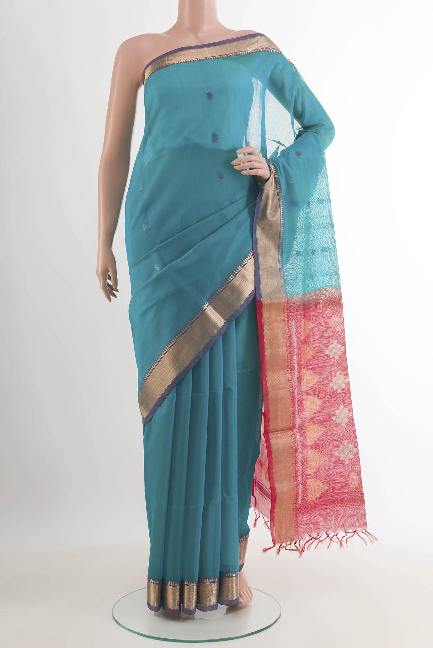 Blue Blended Kora Cotton Saree with Thread Butta on the body and Zari Border.  displayed on a mannequin
