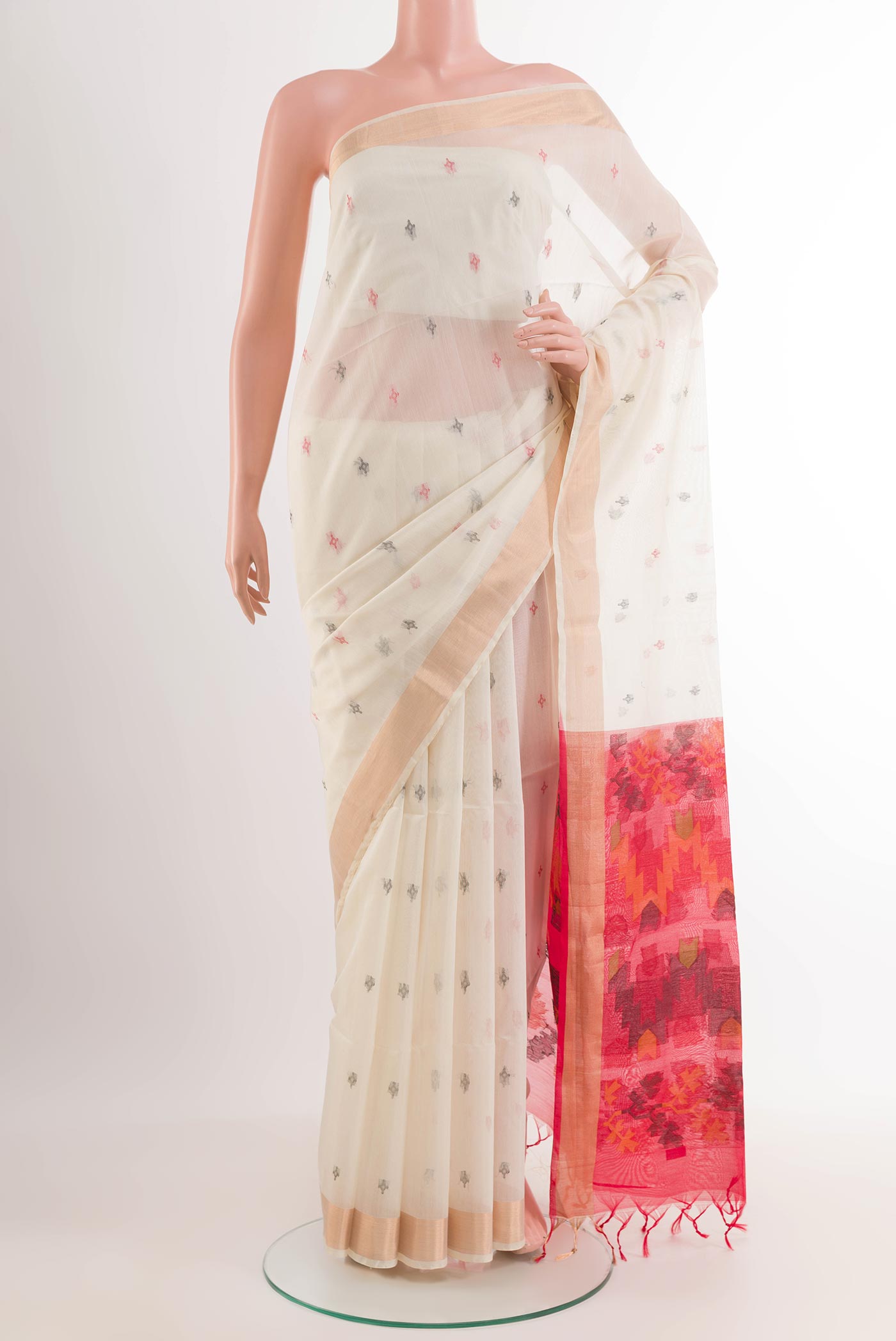 Off White Blended Kora Cotton Saree with Zari Butta on the body and Zari Border.  displayed on a mannequin