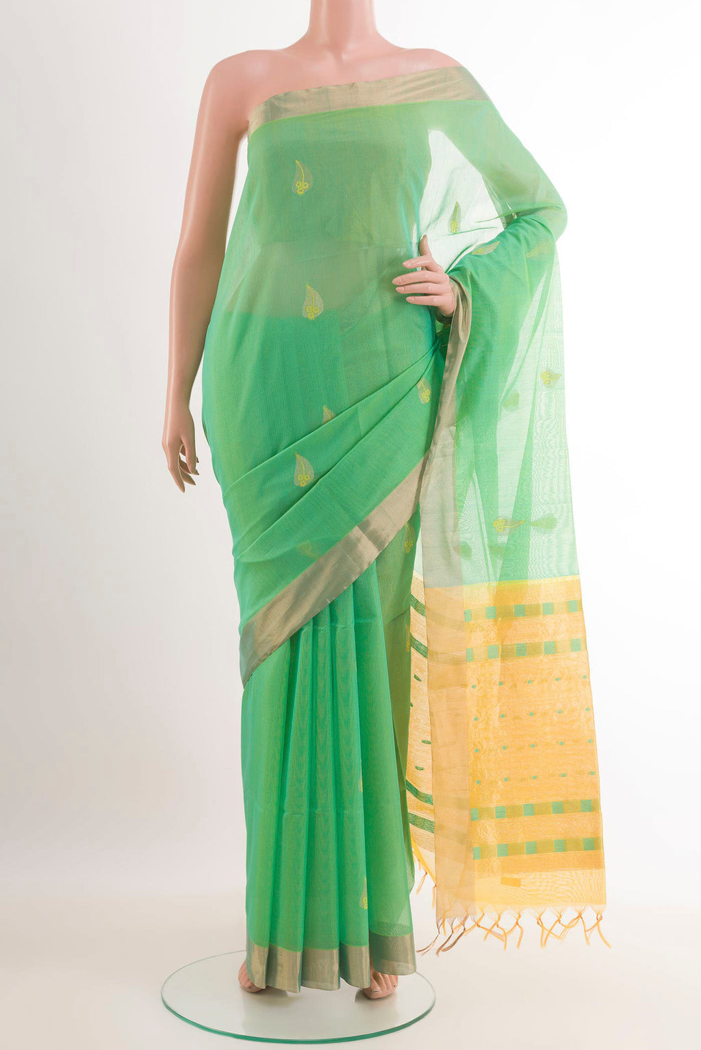 Light Green Blended Kota Cotton Saree with Zari Butta on the body and Zari Border.  displayed on a mannequin