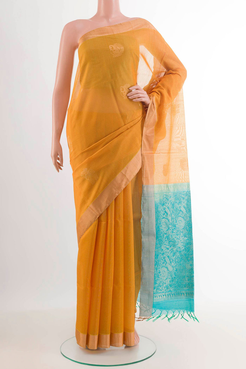 Mustard Blended Kora Cotton Saree with Zari Butta on the body and Zari Border.  displayed on a mannequin