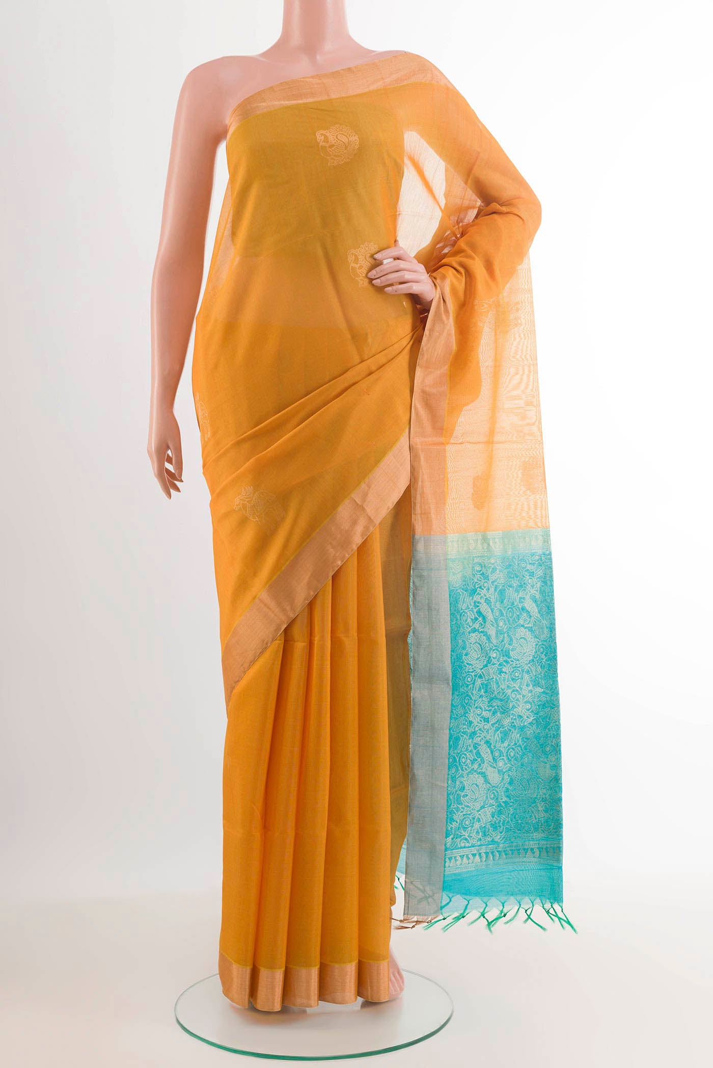 Mustard Blended Kora Cotton Saree with Zari Butta on the body and Zari Border.  displayed on a mannequin