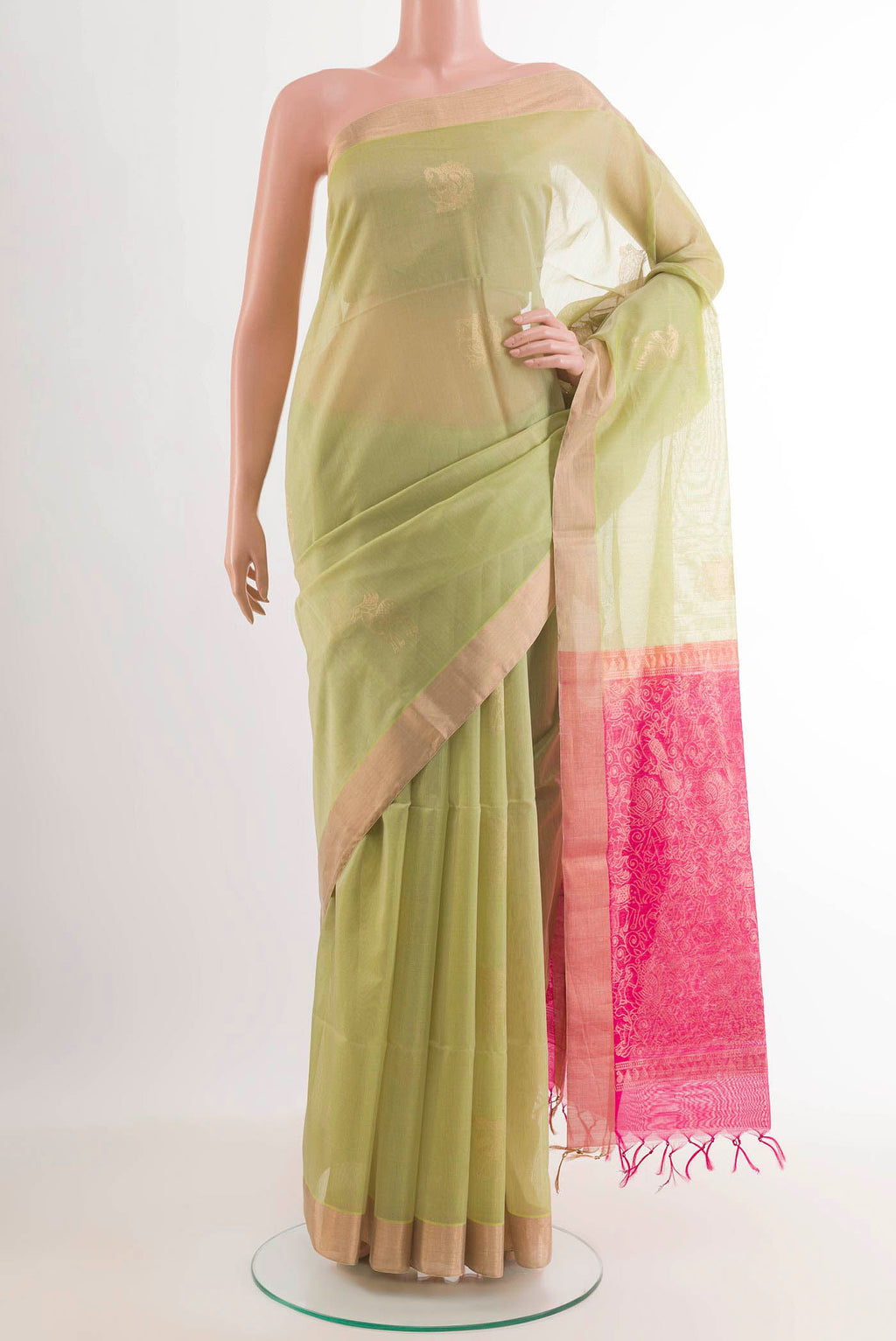 Green Blended Kora Cotton Saree with Zari Butta on the body and Zari Border.  displayed on a mannequin