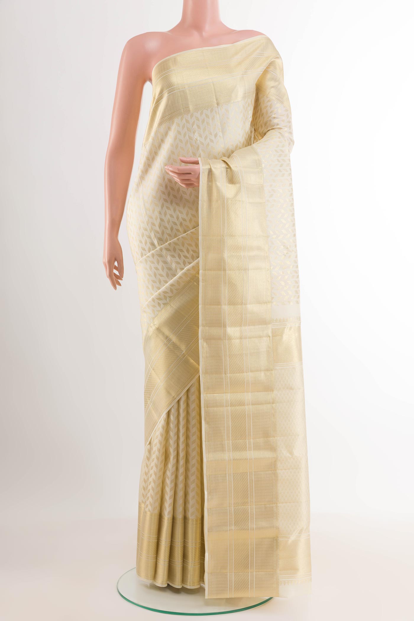 Off White Kanchipuram Silk Saree with Zari Brocade on the body and Plain Border.  displayed on a mannequin