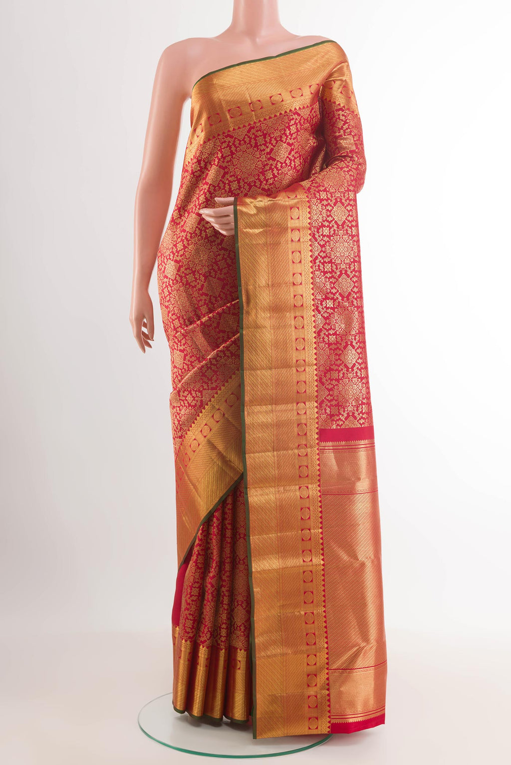 Red Kanchipuram Silk Saree with Zari Brocade on the body and Plain Border.  displayed on a mannequin