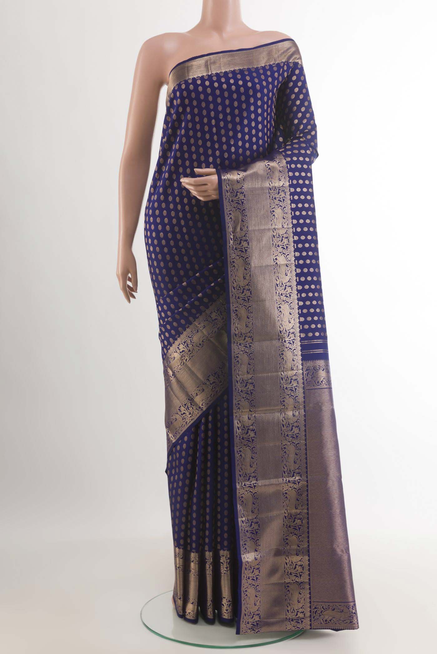 Blue Kanchipuram Silk Saree with Zari Butta on the body and Zari Border.  displayed on a mannequin