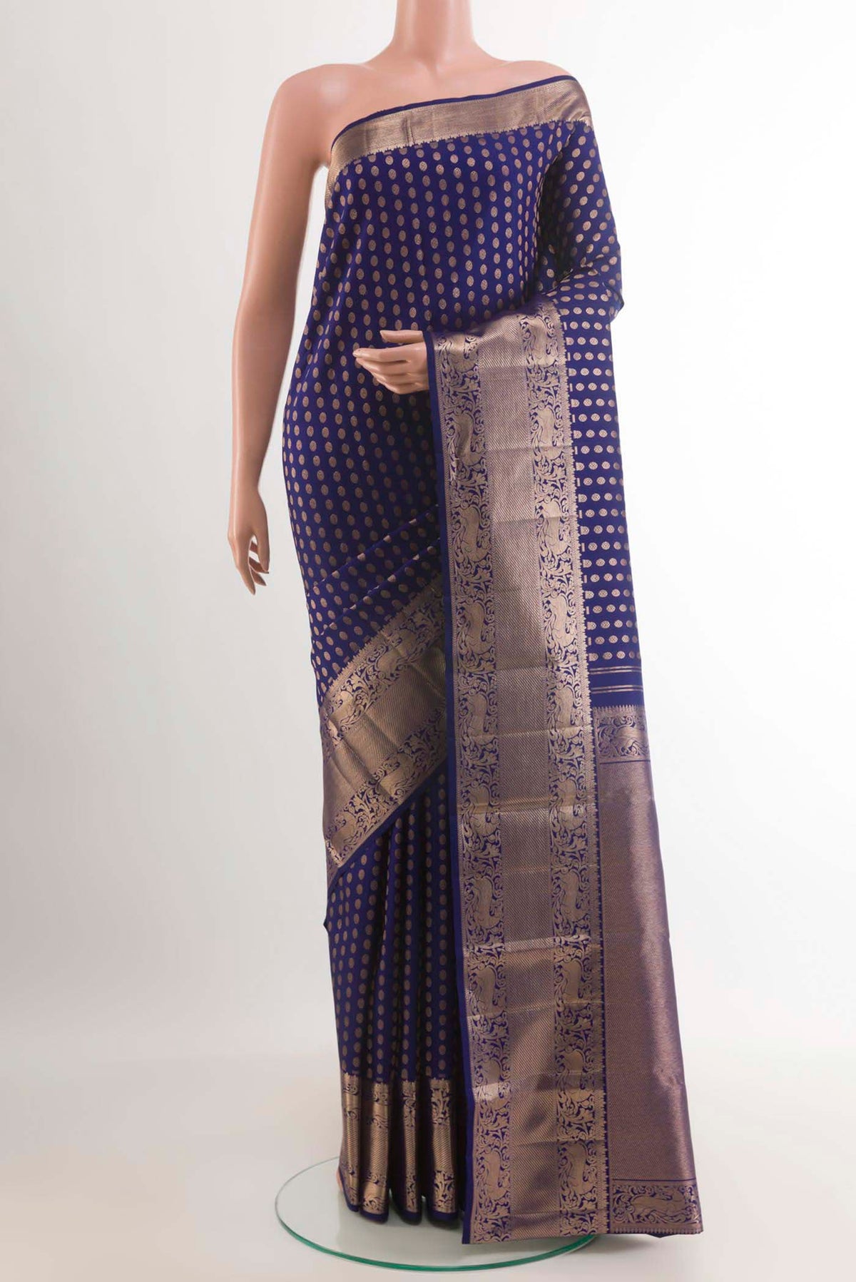 Blue Kanchipuram Silk Saree with Zari Butta on the body and Zari Border.  displayed on a mannequin