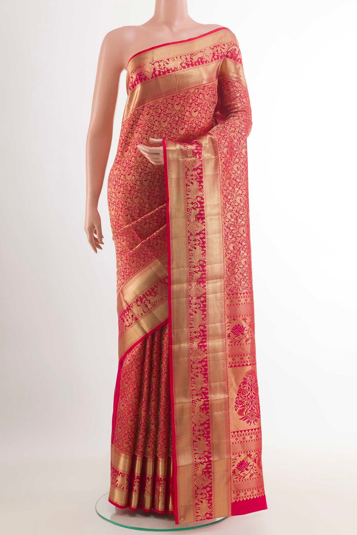 Red Kanchipuram Silk Saree with Zari Butta on the body and Zari Border.  displayed on a mannequin