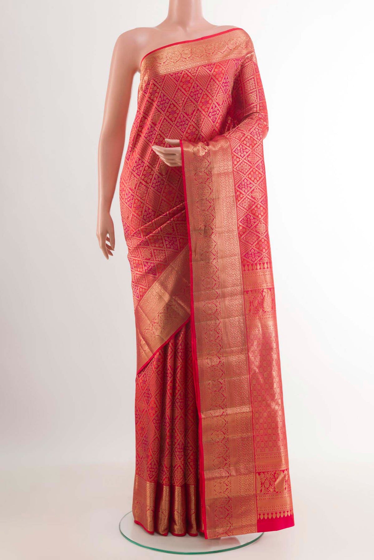 Red Kanchipuram Silk Saree with Zari Brocade on the body and Zari Border.  displayed on a mannequin