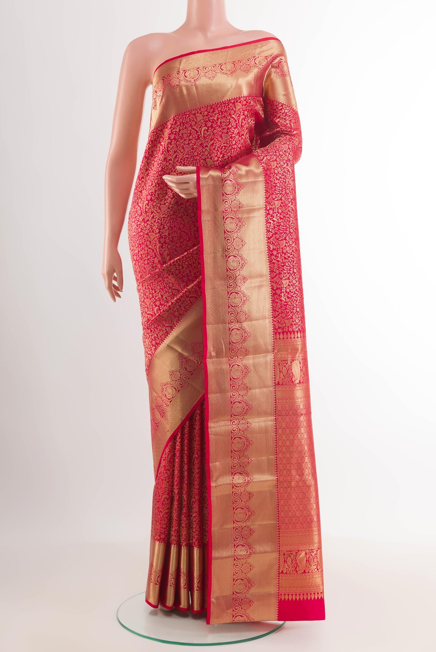 Red Kanchipuram Silk Saree with Zari Brocade on the body and Plain Border.  displayed on a mannequin