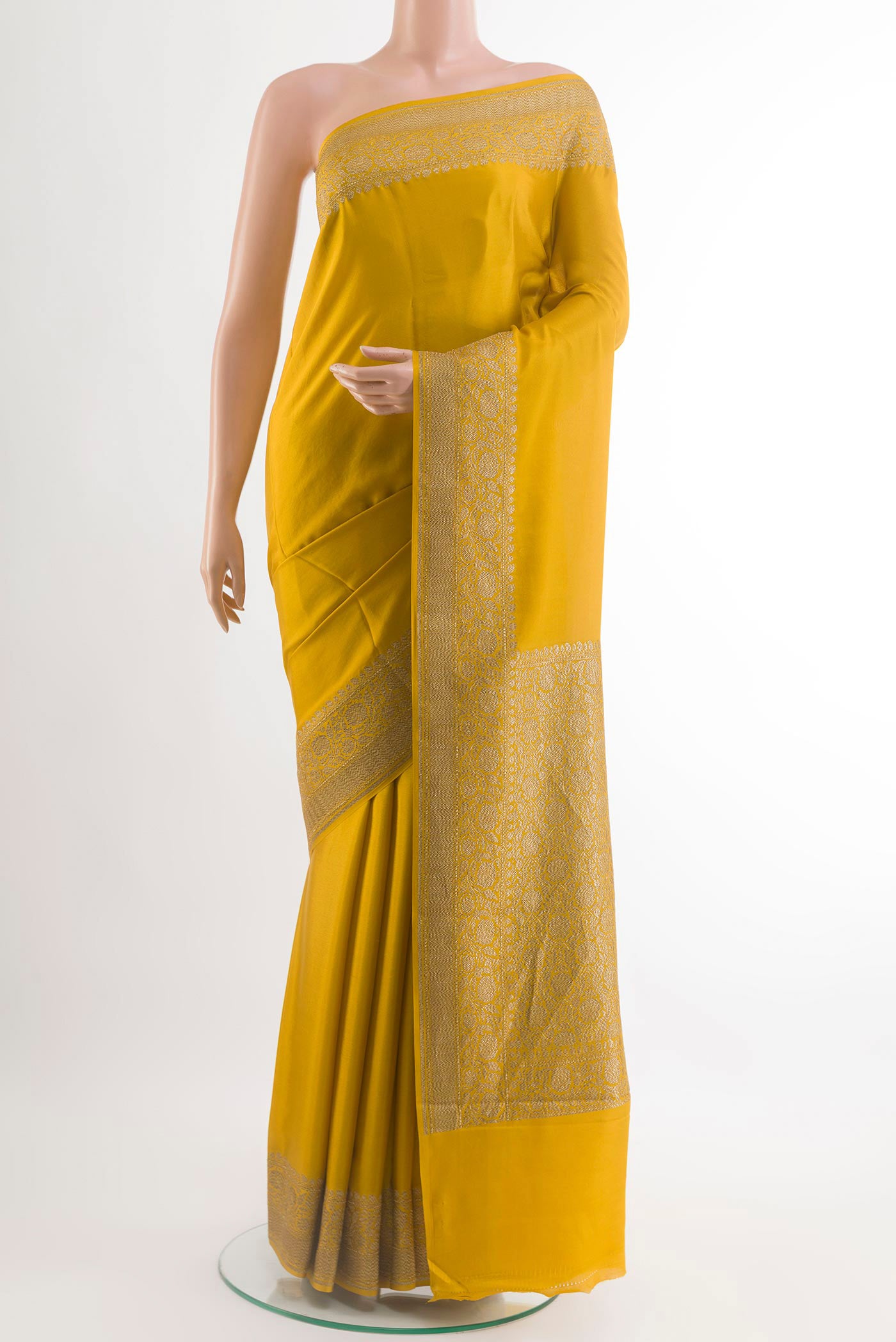 Yellow Mysore Crepe Saree with Plain Body and Plain Border.  displayed on a mannequin