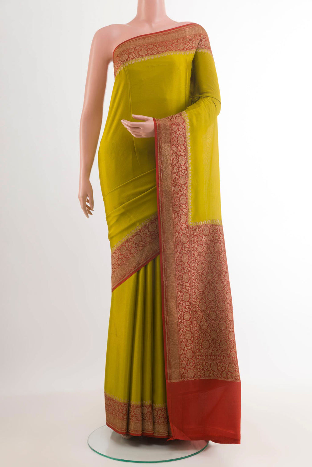 Pickle Green Banarasi Georgette Saree with Plain Body and Zari Border.  displayed on a mannequin