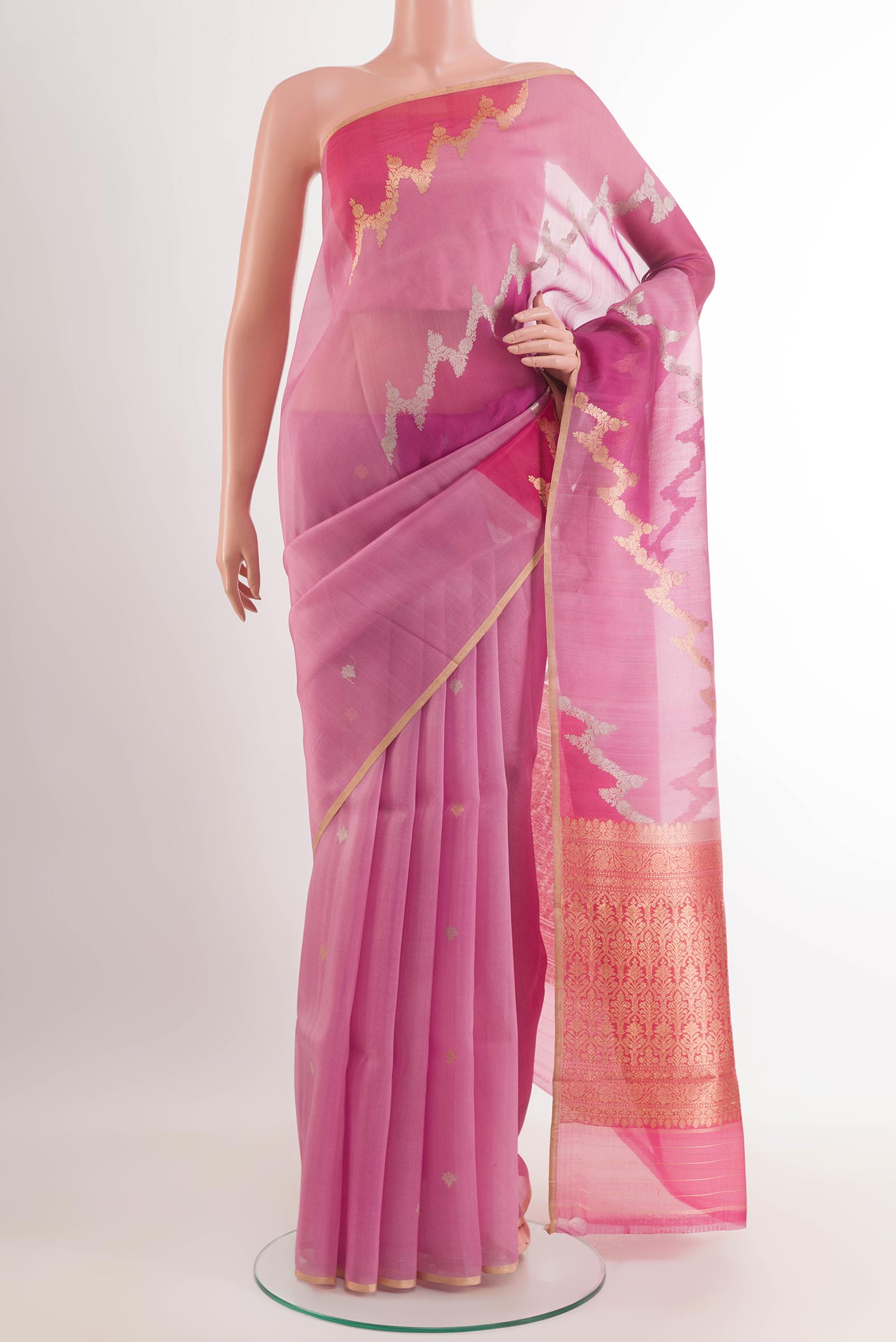 Pink Banarasi Kora Silk Saree with Zari Butta on the body and Zari Border.  displayed on a mannequin