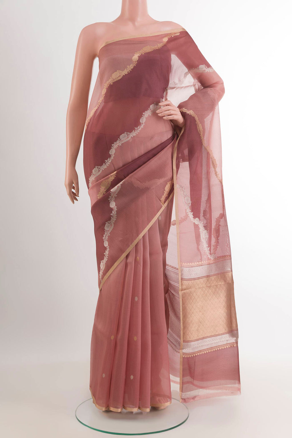 Magenta Banarasi Kora Silk Saree with Zari Butta on the body and Zari Border.  displayed on a mannequin