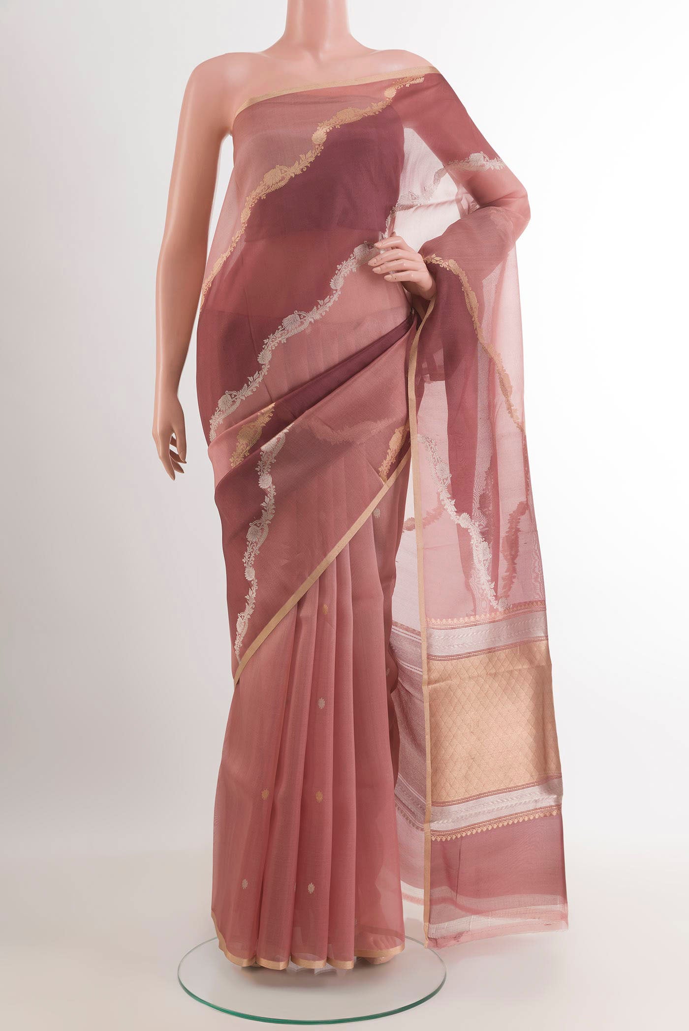 Magenta Banarasi Kora Silk Saree with Zari Butta on the body and Zari Border.  displayed on a mannequin