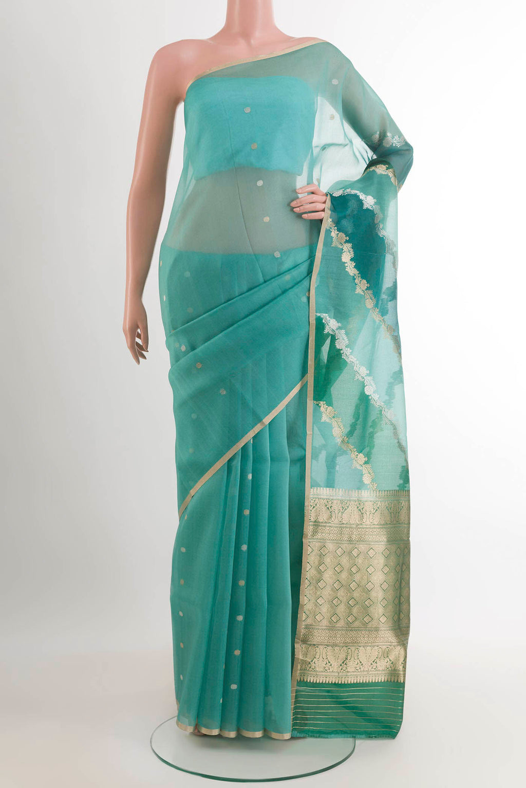 Blue Banarasi Kora Silk Saree with Zari Butta on the body and Plain Border.  displayed on a mannequin