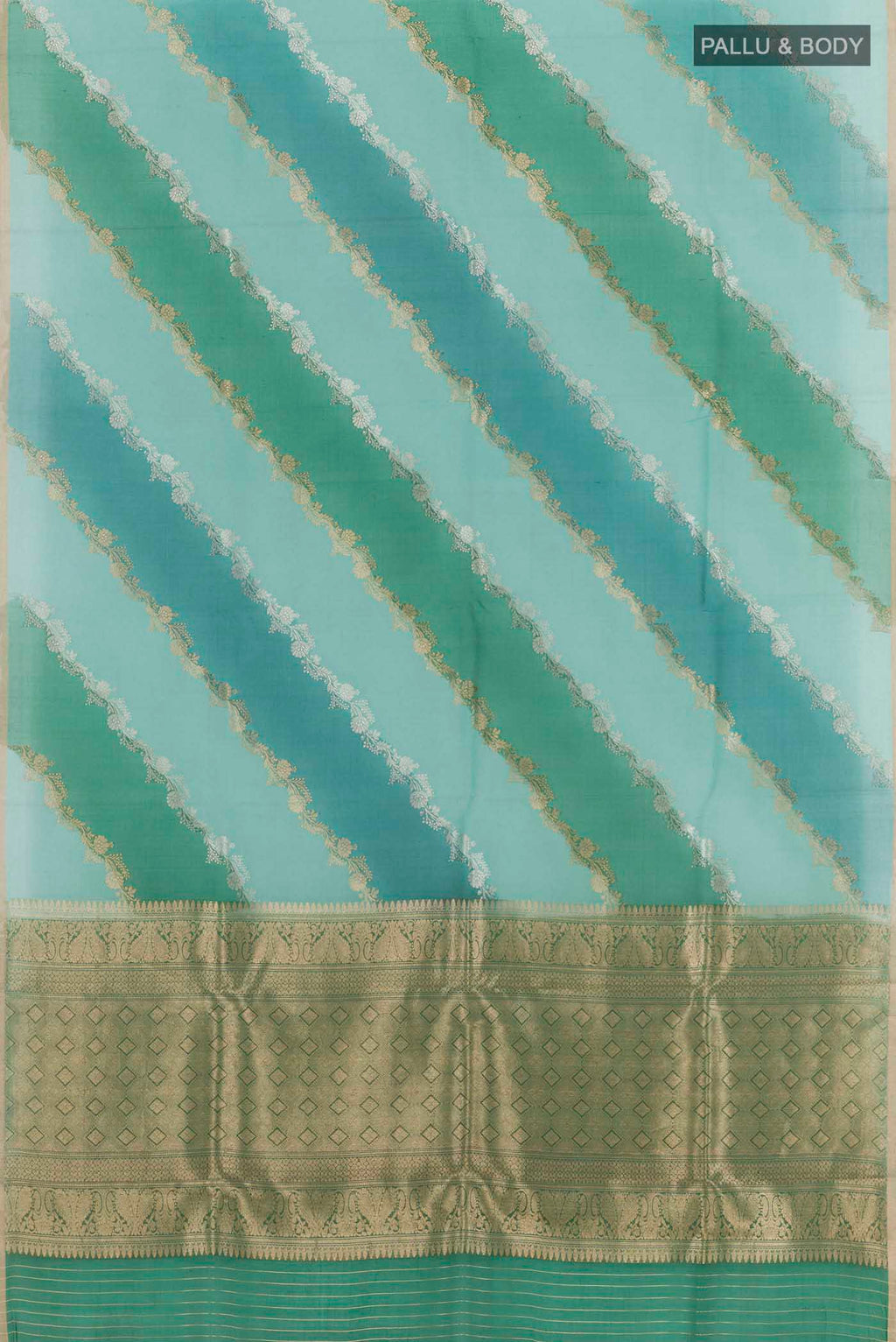 Flat view of Blue Banarasi Kora Silk Saree with Zari Butta on the body and Plain Border. 