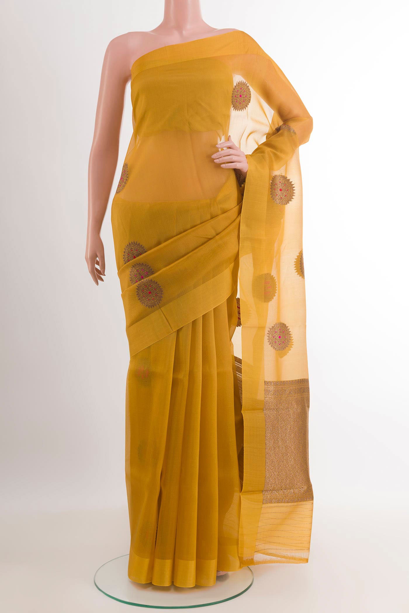 Yellow Banarasi Kora Silk Saree with Zari Butta on the body and Plain Border.  displayed on a mannequin