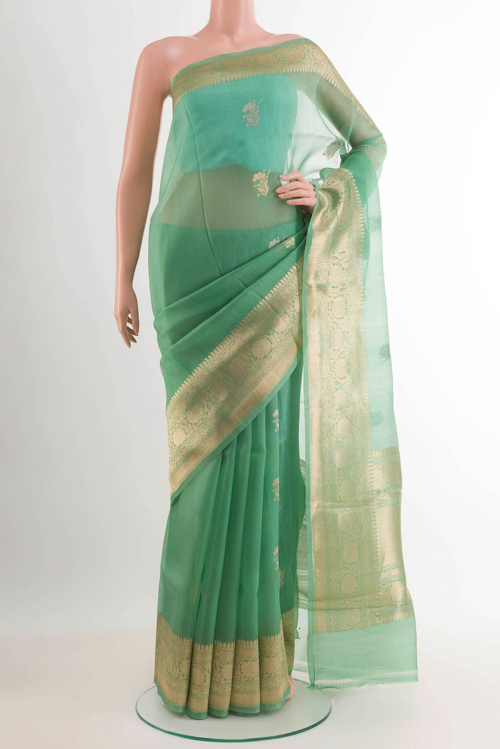 Sea Green Banarasi Kora Silk Saree with Zari Butta on the body and Zari Border.  displayed on a mannequin