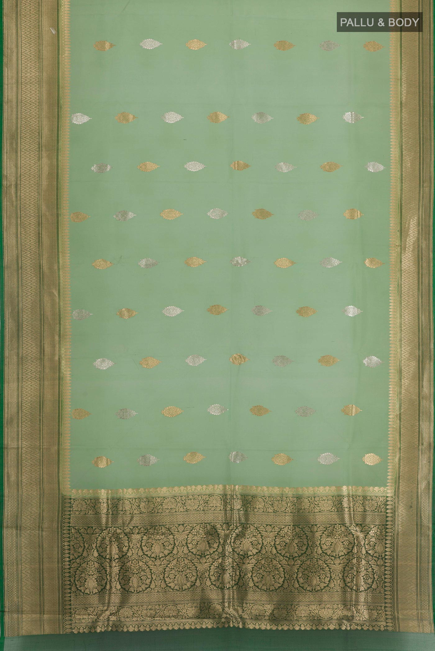 Flat view of Green Banarasi Kora Silk Saree with Zari Butta on the body and Zari Border. 
