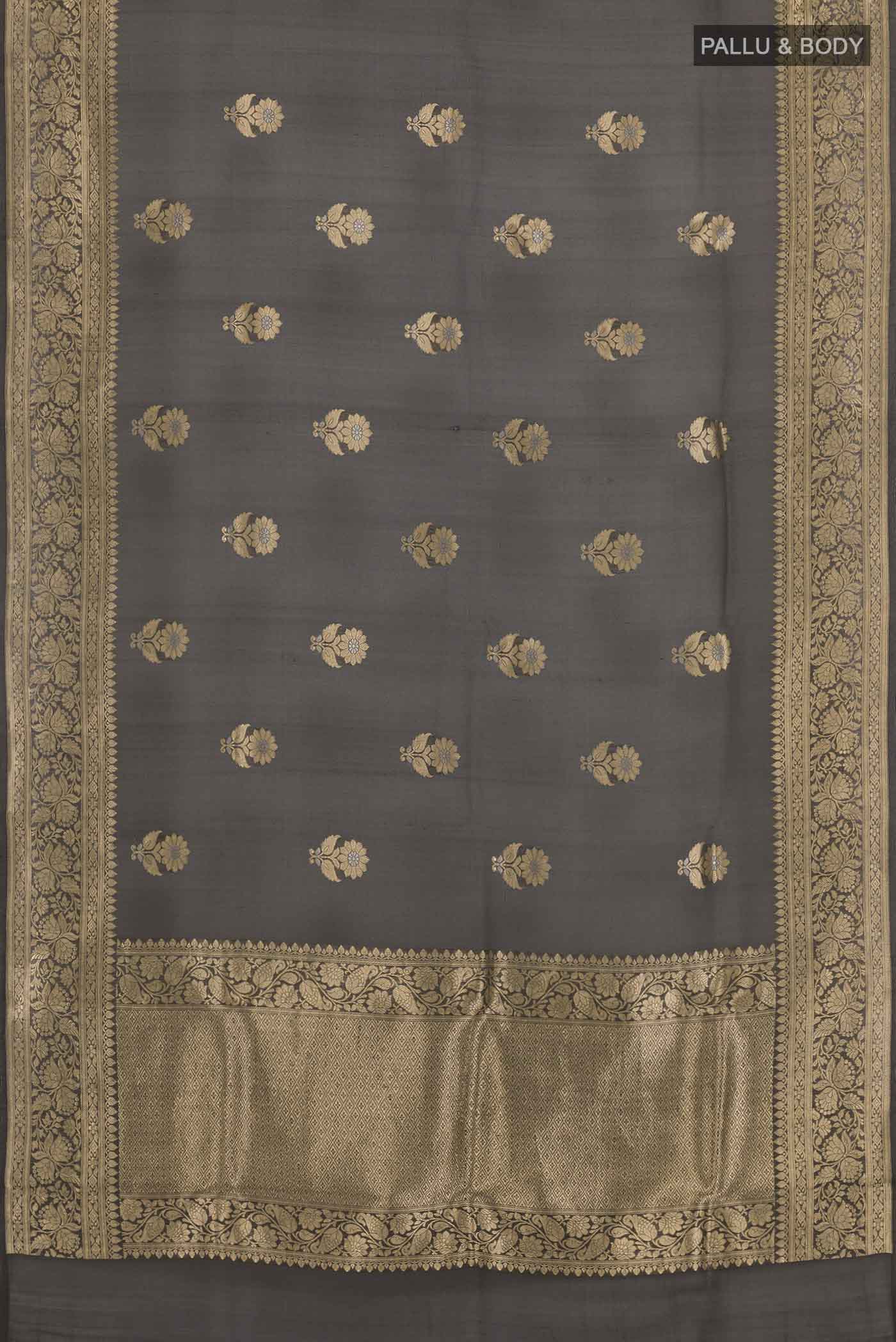 Flat view of Black Banarasi Kora Silk Saree with Zari Butta on the body and Zari Border. 