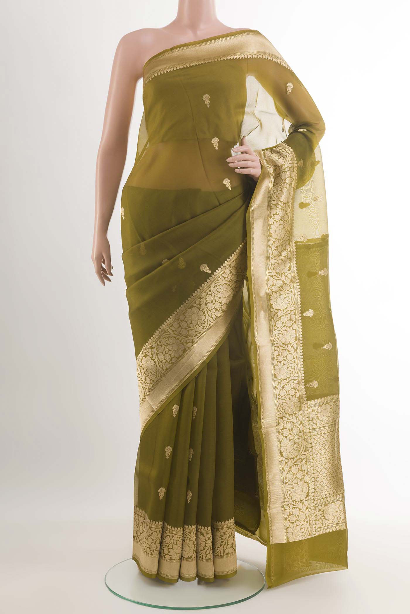 Mehandi Green Banarasi Kora Silk Saree with Zari Butta on the body and Zari Border.  displayed on a mannequin