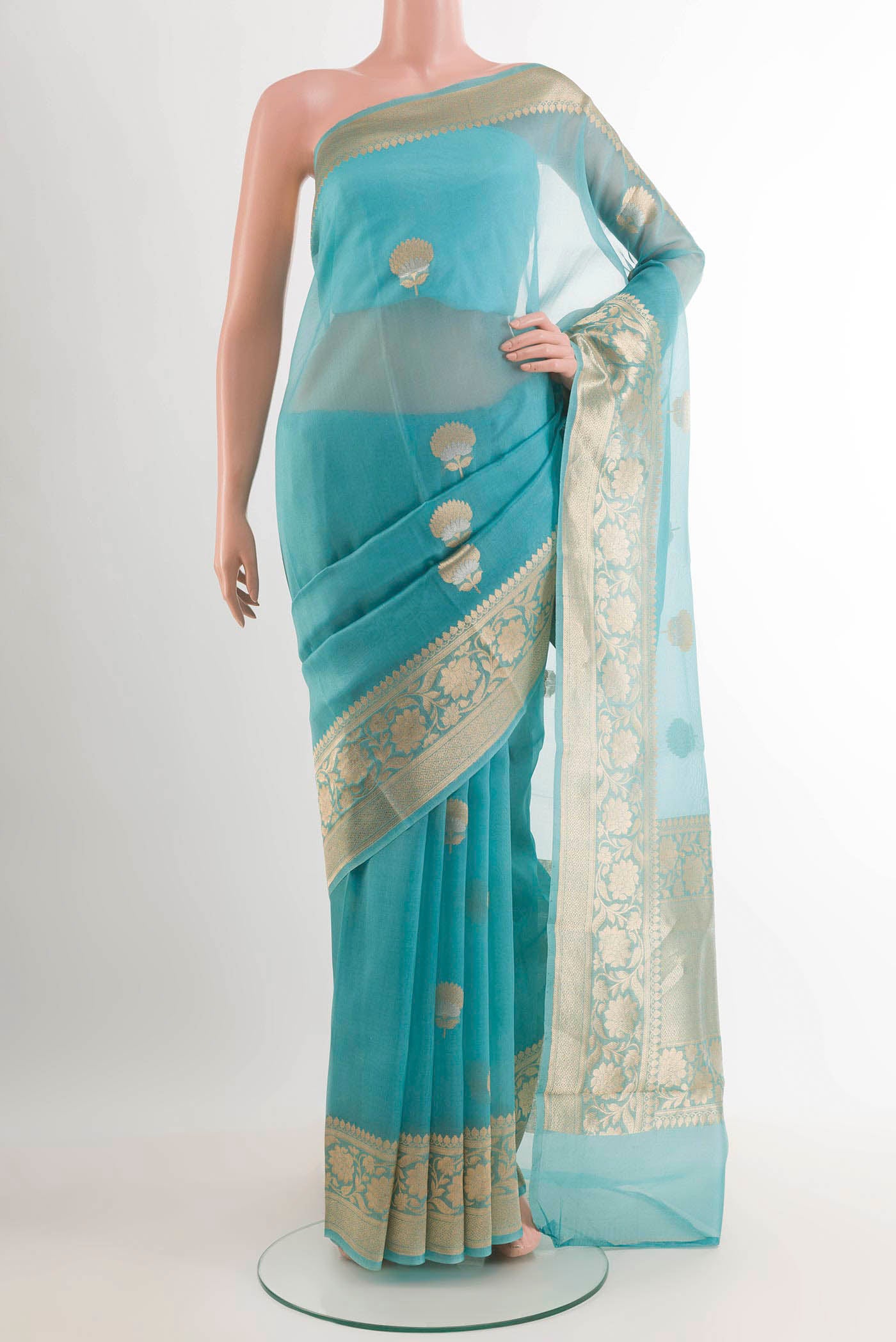 Sky Blue Banarasi Kora Silk Saree with Zari Butta on the body and Zari Border.  displayed on a mannequin
