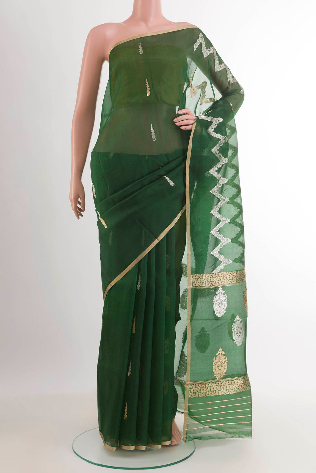 Green Banarasi Kora Silk Saree with Zari Butta on the body and Plain Border.  displayed on a mannequin