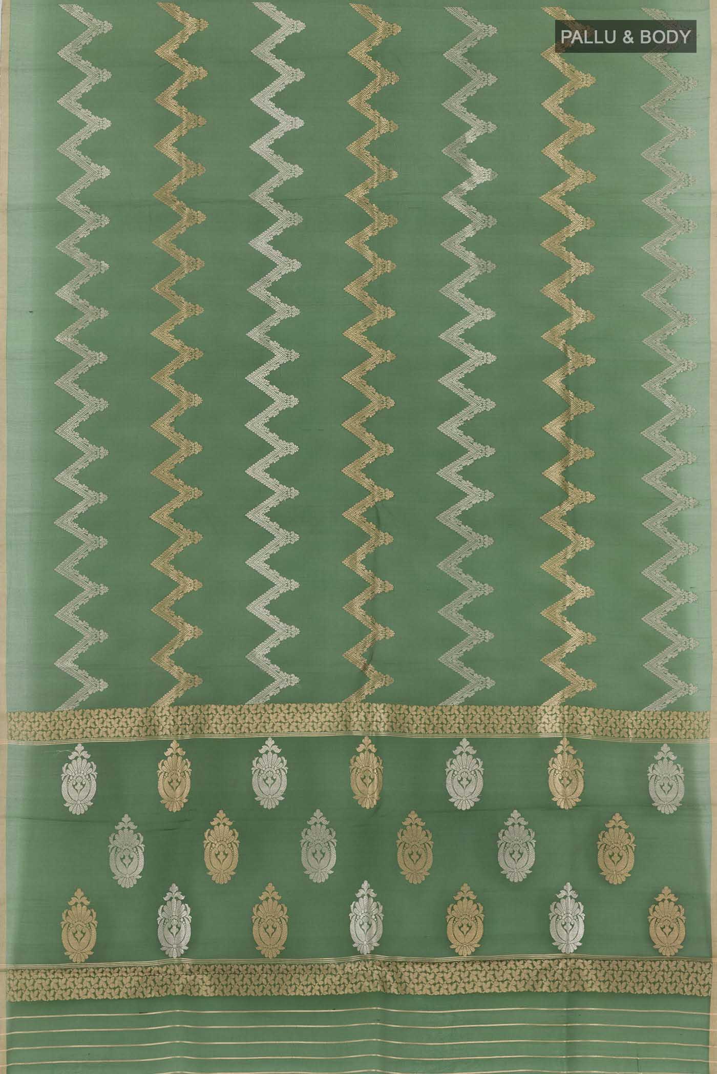 Flat view of Green Banarasi Kora Silk Saree with Zari Butta on the body and Plain Border. 