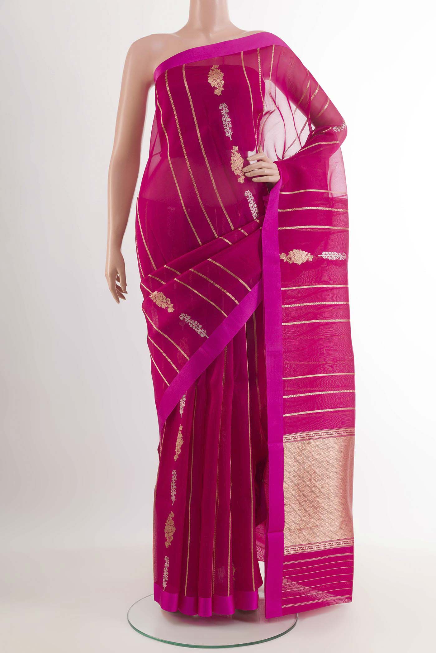 Rani Pink Banarasi Kora Silk Saree with Zari Butta on the body and Zari Border.  displayed on a mannequin