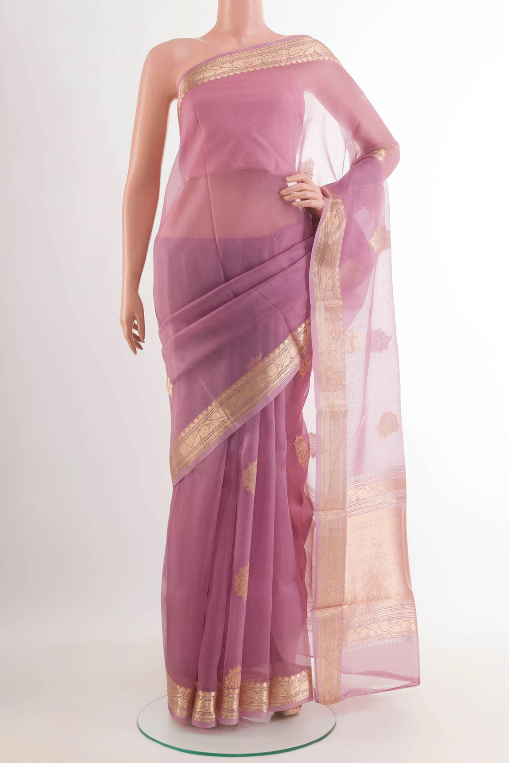 Lavender Banarasi Kora Silk Saree with Zari Butta on the body and Zari Border.  displayed on a mannequin