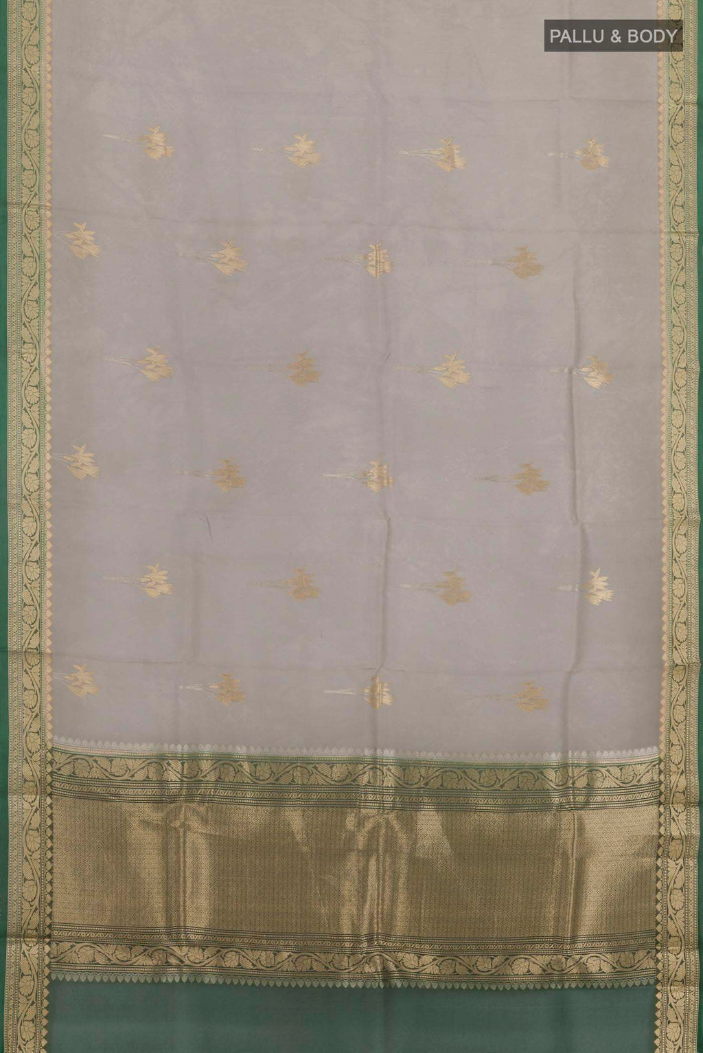 Flat view of Grey Banarasi Kora Silk Saree with Zari Butta on the body and Zari Border. 