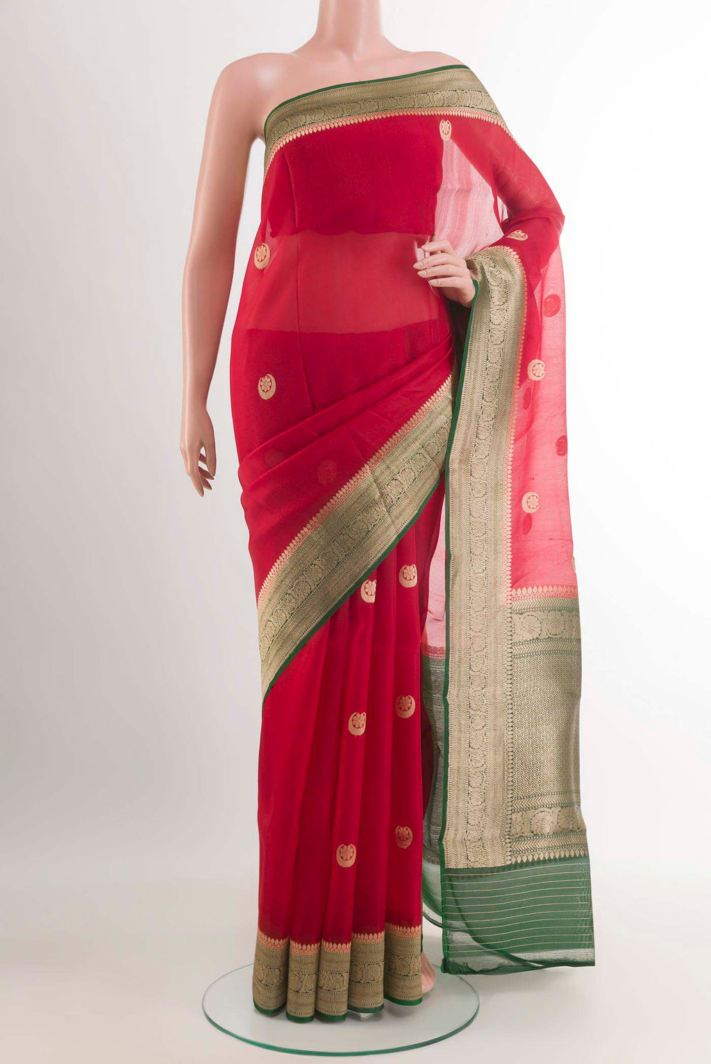 Red Banarasi Kora Silk Saree with Zari Butta on the body and Zari Border.  displayed on a mannequin