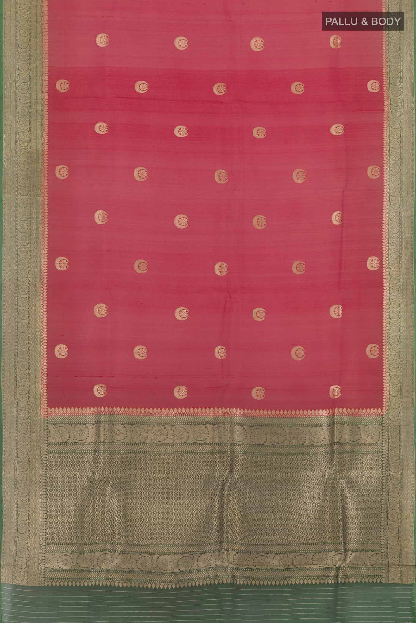 Flat view of Red Banarasi Kora Silk Saree with Zari Butta on the body and Zari Border. 