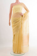 Lemon Yellow Banarasi Kora Silk Saree with Zari Butta on the body and Zari Border.  displayed on a mannequin
