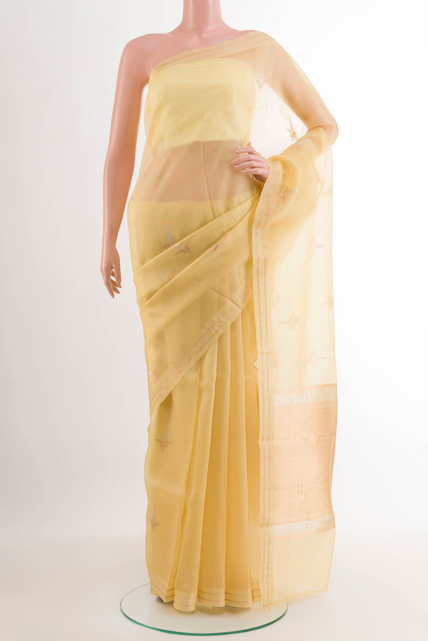 Lemon Yellow Banarasi Kora Silk Saree with Zari Butta on the body and Zari Border.  displayed on a mannequin