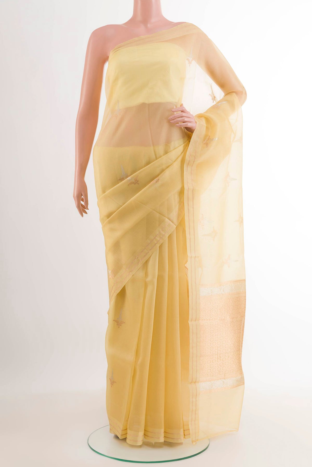 Lemon Yellow Banarasi Kora Silk Saree with Zari Butta on the body and Zari Border.  displayed on a mannequin