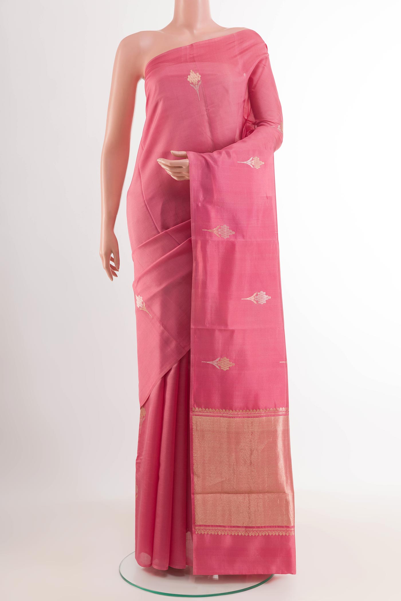 Pink Banarasi Katan Silk Saree with Zari Butta on the body and Plain Border.  displayed on a mannequin