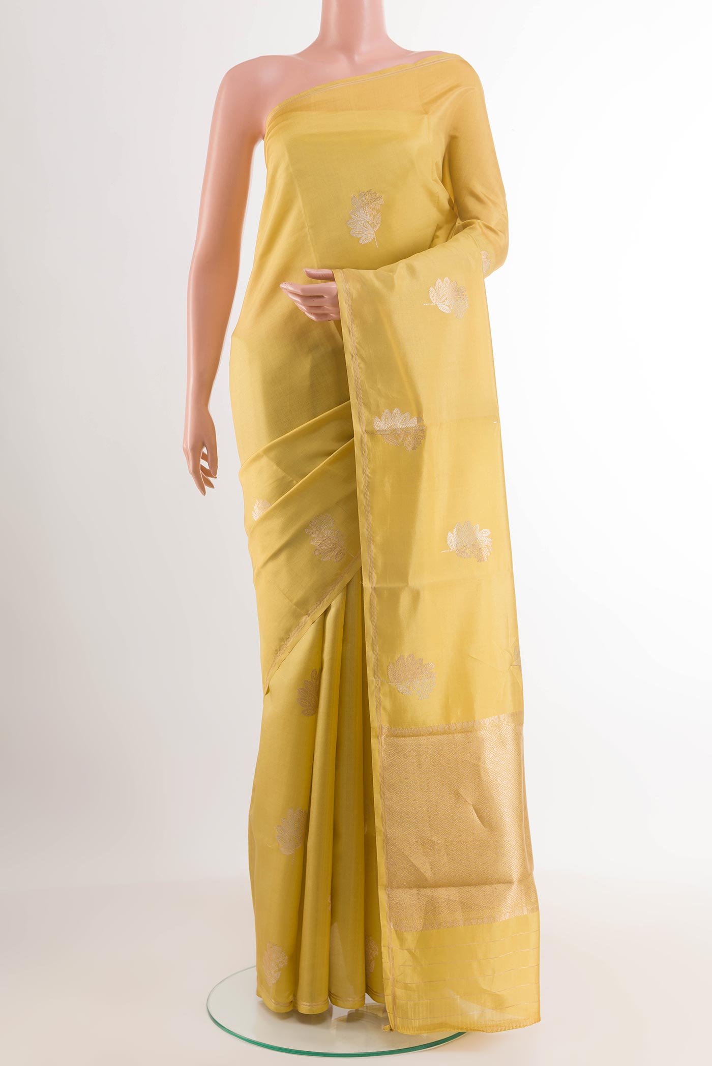 Lemon Yellow Banarasi Katan Silk Saree with Zari Butta on the body and Plain Border.  displayed on a mannequin