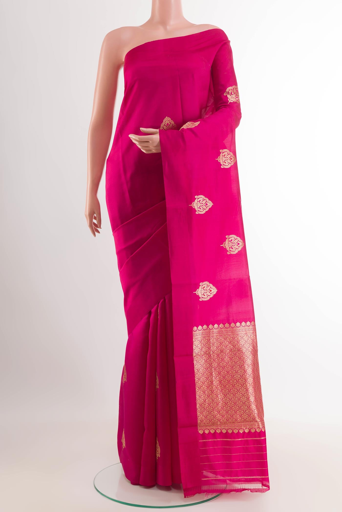 Pink Banarasi Katan Silk Saree with Zari Butta on the body and Plain Border.  displayed on a mannequin