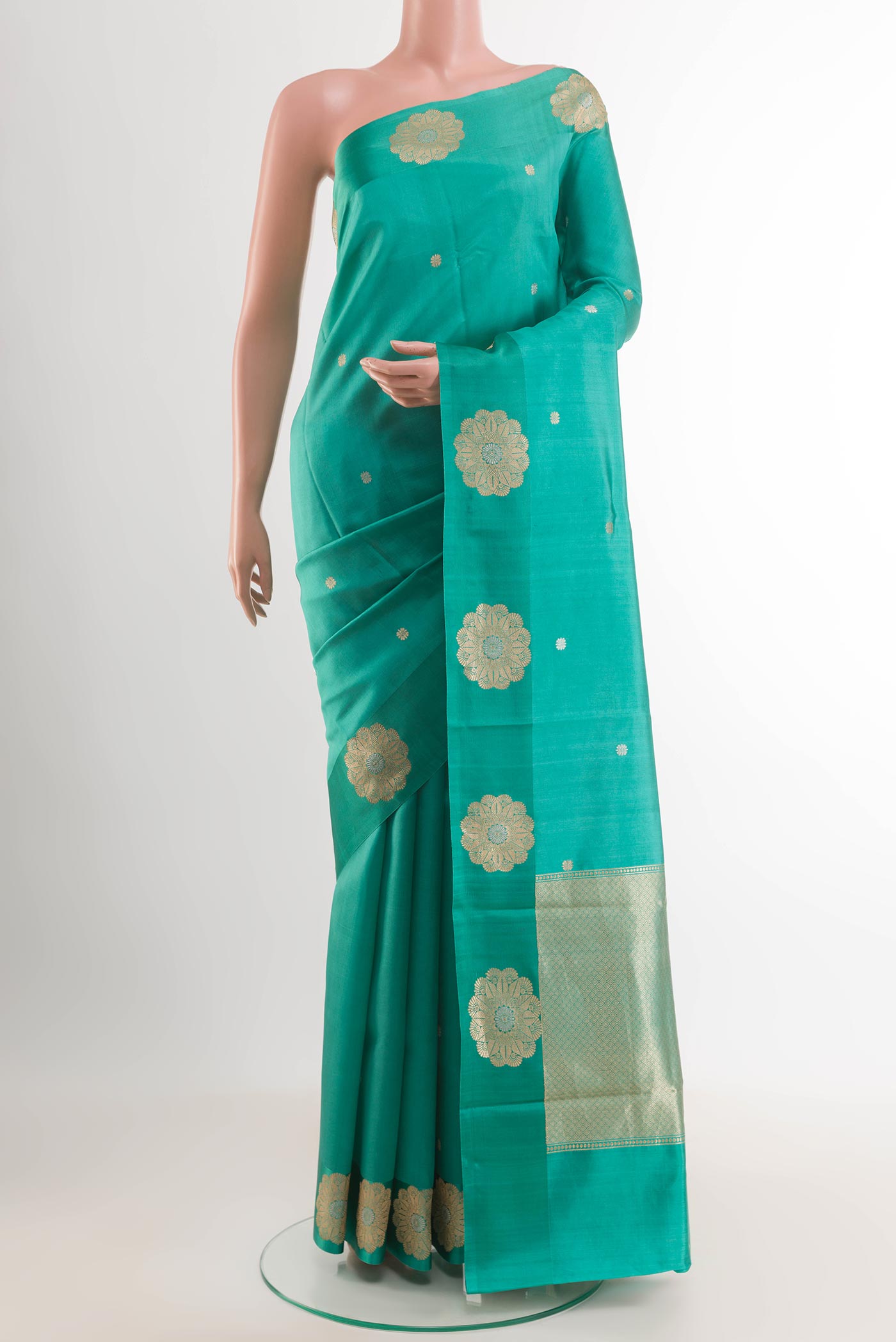Sky Blue Banarasi Katan Silk Saree with Zari Butta on the body and Plain Border.  displayed on a mannequin