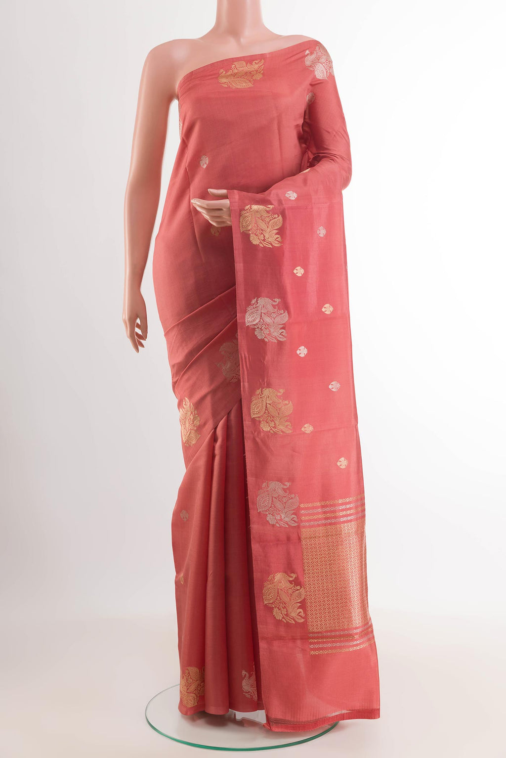 Peach Banarasi Katan Silk Saree with Zari Butta on the body and Plain Border.  displayed on a mannequin