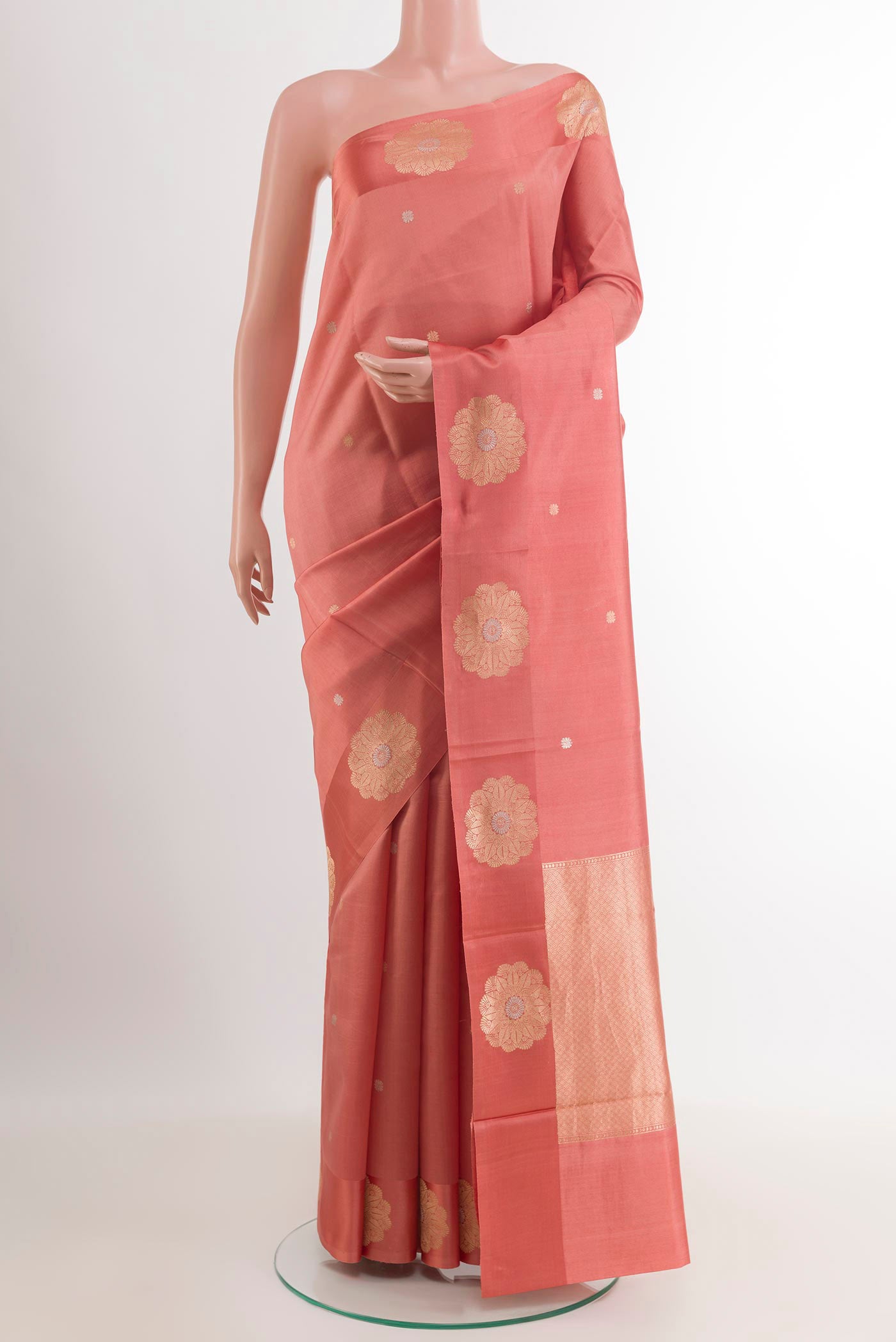 Peach Banarasi Katan Silk Saree with Zari Butta on the body and Zari Border.  displayed on a mannequin