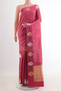 Pink Banarasi Katan Silk Saree with Zari Butta on the body and Zari Border.  displayed on a mannequin
